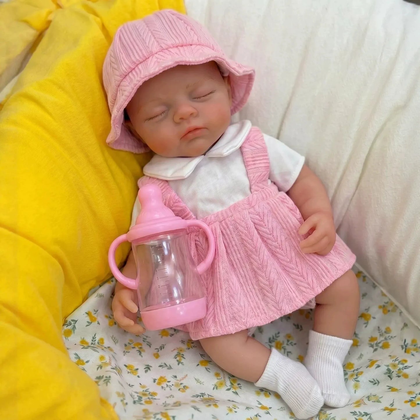 Bambola reborn Irys da 30cm interamente in silicone con vestito rosa