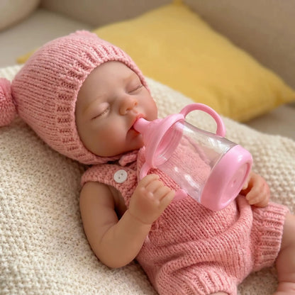 Bambola reborn Irys da 30cm interamente in silicone bambina con abiti rosa