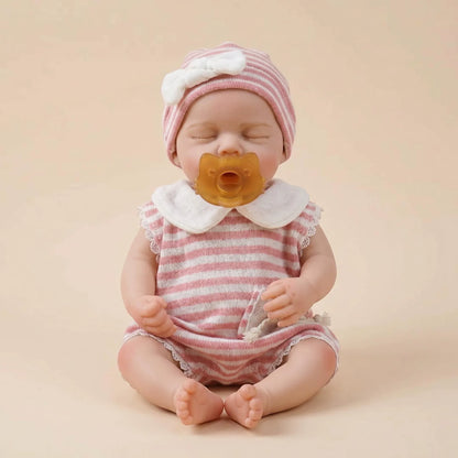 Bambola reborn Loulou da 30cm interamente in silicone con vestitino a righe rosa