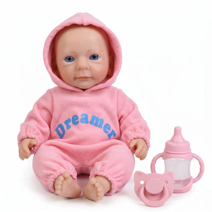 Bambina reborn Felicia da 30cm interamente in silicone con vestitino rosa