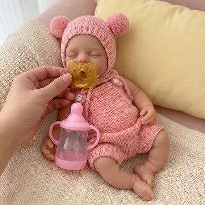 Bambola reborn Irys da 30cm interamente in silicone bambina con abiti rosa