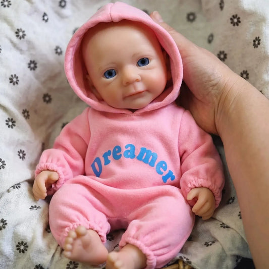 Bambina reborn Felicia da 30cm interamente in silicone con vestitino rosa