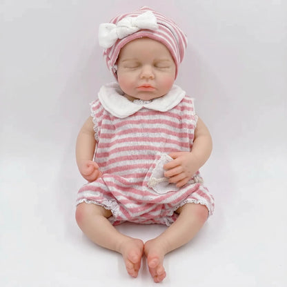 Bambola reborn Loulou da 30cm interamente in silicone con vestitino a righe rosa