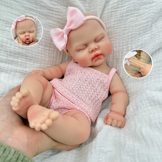 Bambola reborn Pickle 30 cm interamente in silicone con occhi chiusi vestita di rosa