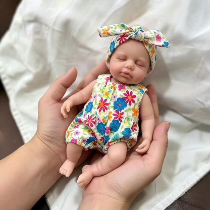 Mini bambola Reborn Loulou da 20 cm in silicone pieno con tutina a fiori
