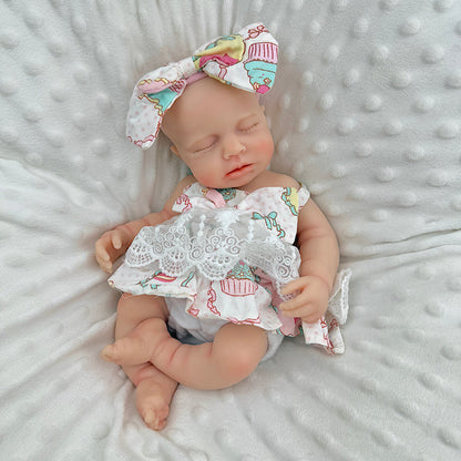 Bambola Reborn Loulou da 30 cm in silicone pieno occhi chiusi con vestitino in pizzo a fiori