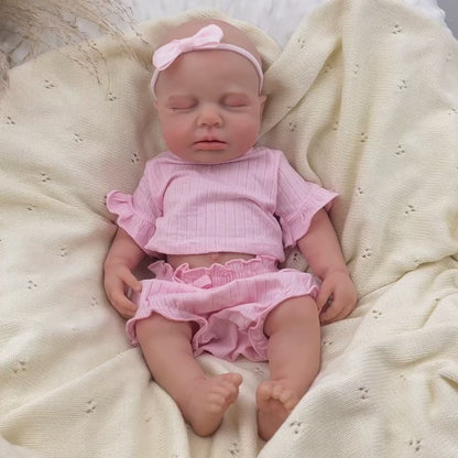 Bambina Reborn Loulou da 45 cm in silicone pieno ed elastico (occhi chiusi) con completino rosa