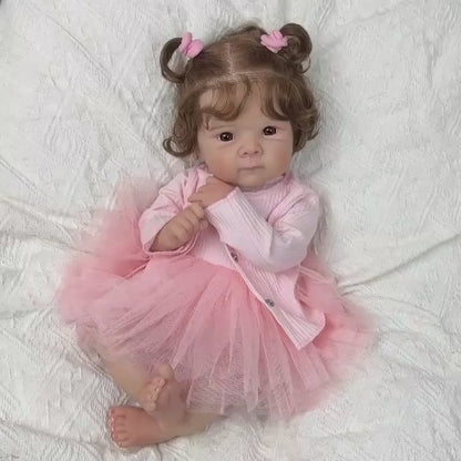 Bambola Reborn Bettie con corpo morbido e occhi aperti da 48 cm in abito rosa