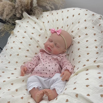 Bambina reborn Loulou addormentata in silicone estensibile alta 45 cm con vestitino a pois rosa
